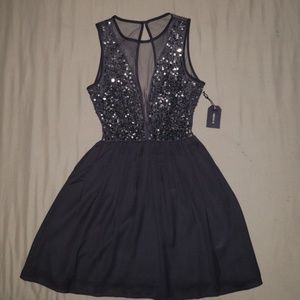 Black sequence top fit and flair dress.